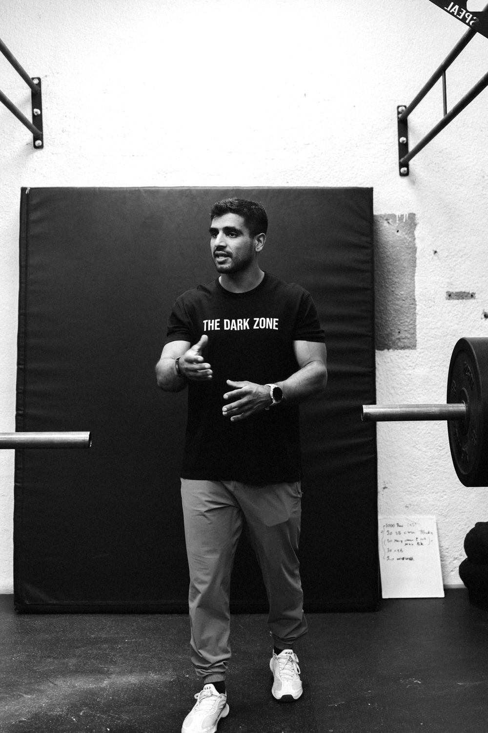 Dark Zone coach explaining a session in the gym